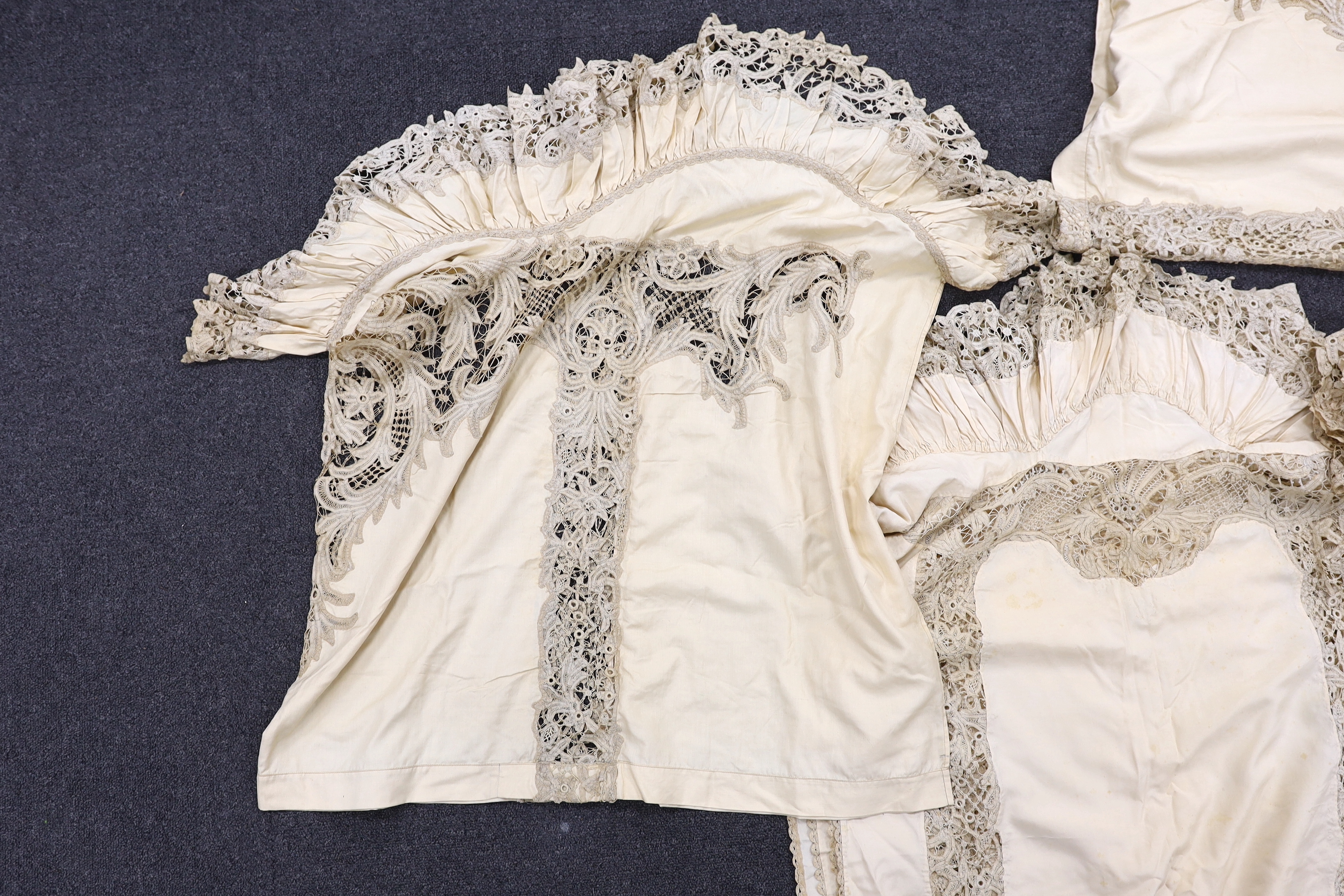 One long cream silk curtain decorated with tape lace insertions and frilled border, 226cm long x 134cm wide, together with three small curtains, 135cm x 74cm deep